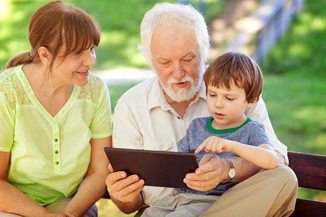 senior grandparents grandson tablet retire