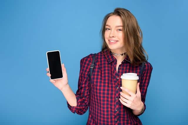 smiling girl happy on smartphone