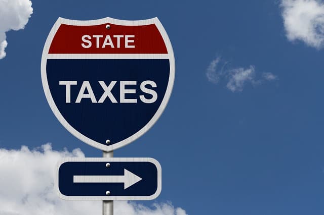 state taxes road sign with arrow