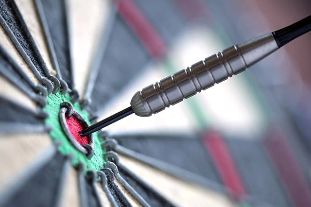 8 Best T. Rowe Price Funds to Buy for 2026 10 a camera focuses on a dart hitting a bullseye.