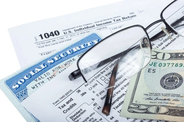 tax form social security card money glasses