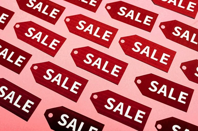 a group of sale tags.