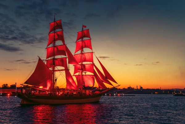 a ship with red sails similar to the vanguard logo.