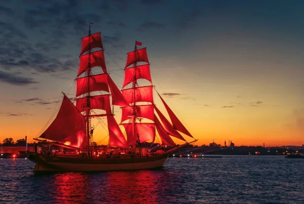 a ship with red sails similar to the vanguard logo.