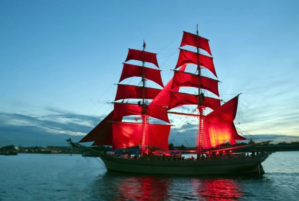 a ship with red sails similar to the vanguard logo.