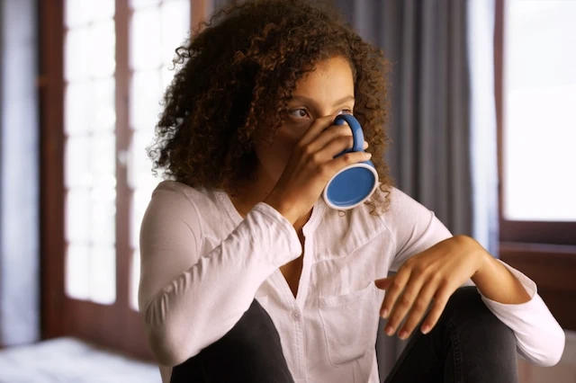 woman drinking coffee morning