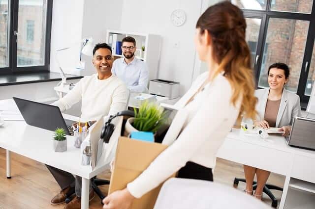 woman packing her things leaving job