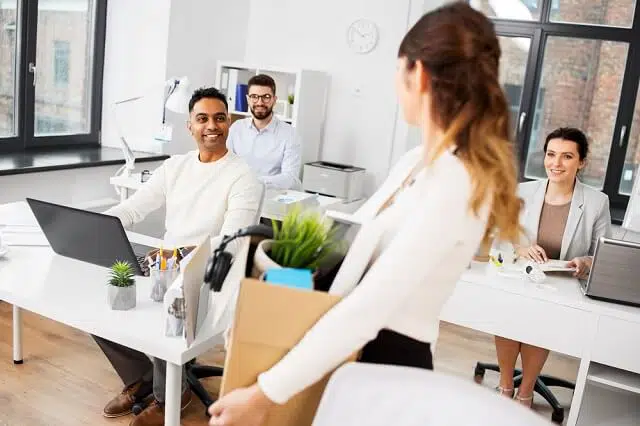 woman packing her things leaving job