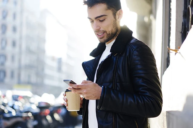 young man smartphone app online coffee