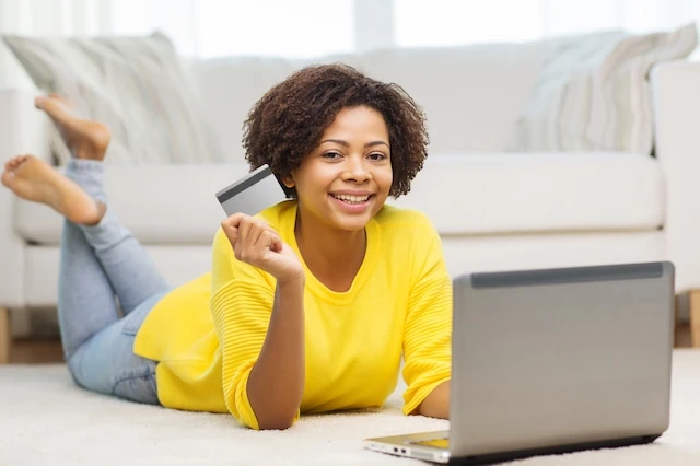 young woman debit credit card floor