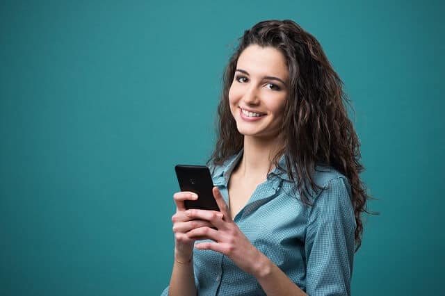 young woman investing on smartphone